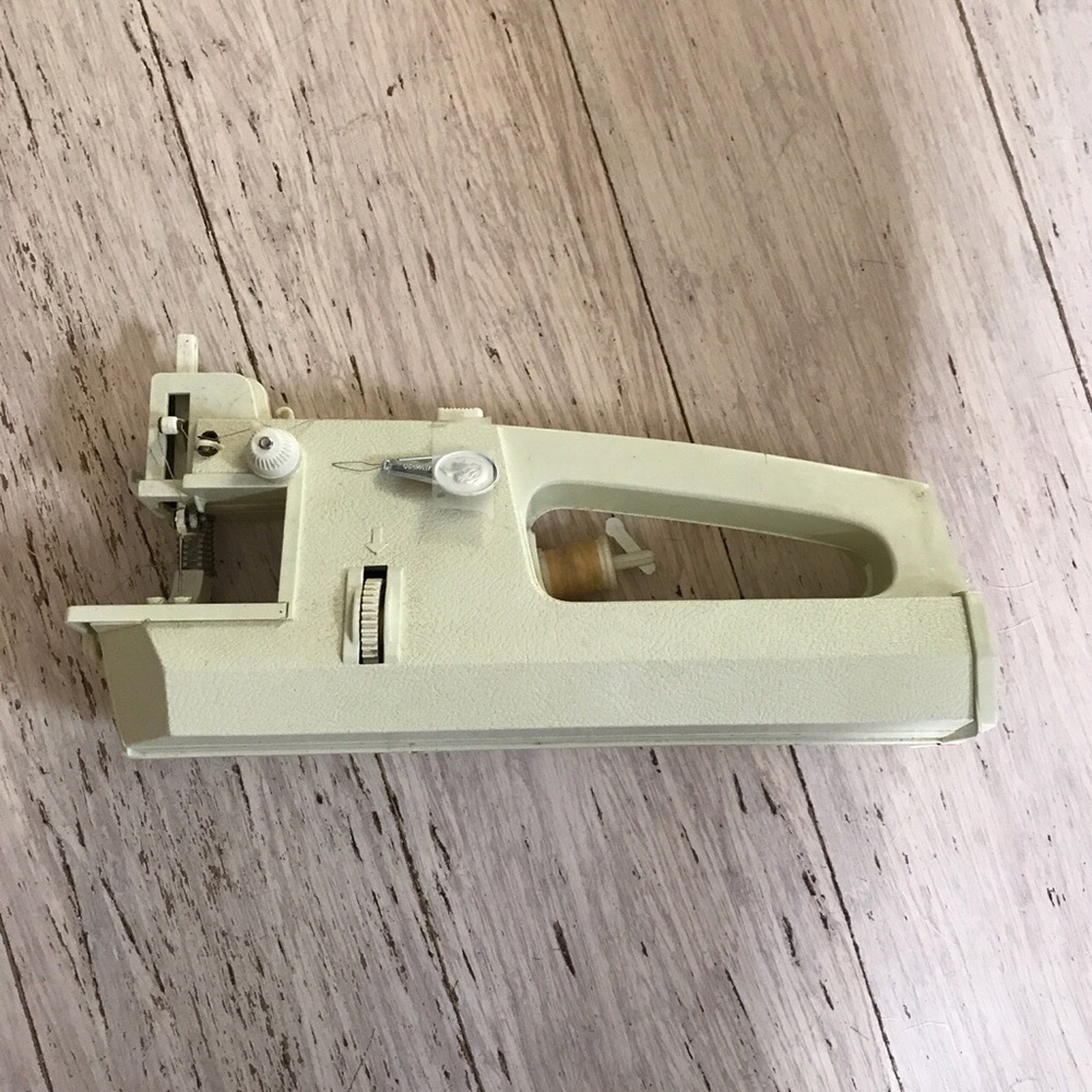 Handheld vintage sewing machine